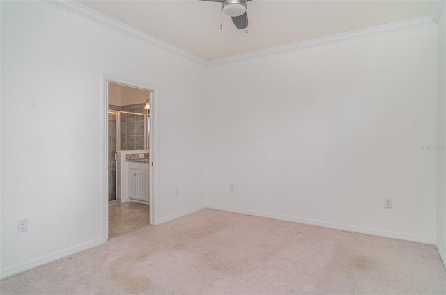 12515 Garibaldi Ln, Venice, FL 34293 - unfurnished bedroom with ornamental molding, light carpet, baseboards, ensuite bath, and ceiling fan