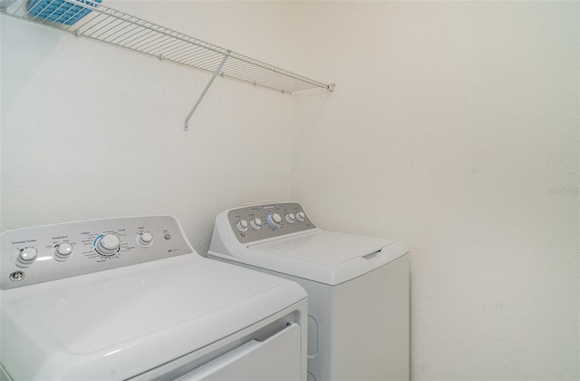 12515 Garibaldi Ln, Venice, FL 34293 - laundry area with washing machine and clothes dryer