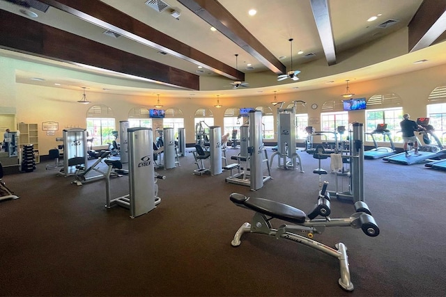 12515 Garibaldi Ln, Venice, FL 34293 - exercise room featuring beam ceiling, ceiling fan, plenty of natural light, and recessed lighting