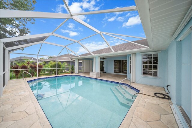 1314 SE 15th Ter, Cape Coral, FL 33990 - swimming pool featuring a patio area, ceiling fan, and glass enclosure