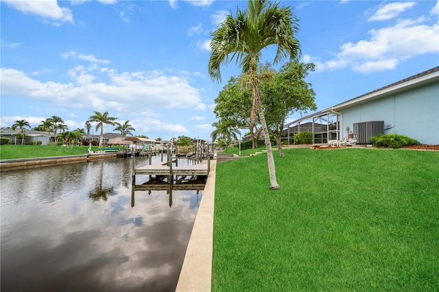 1314 SE 15th Ter, Cape Coral, FL 33990 - dock featuring a water view, a lawn, and a lanai
