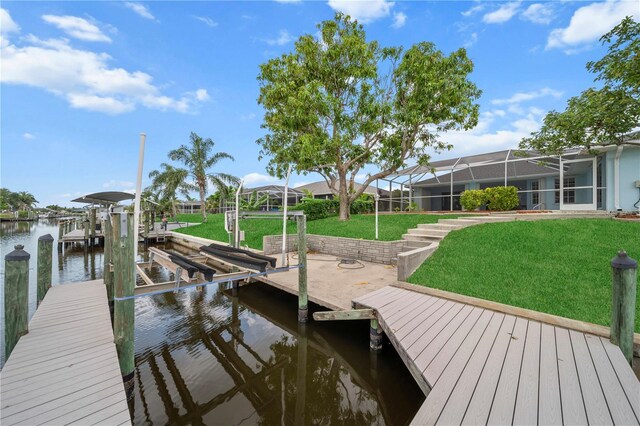 1314 SE 15th Ter, Cape Coral, FL 33990 - dock featuring boat lift, a water view, a yard, and glass enclosure