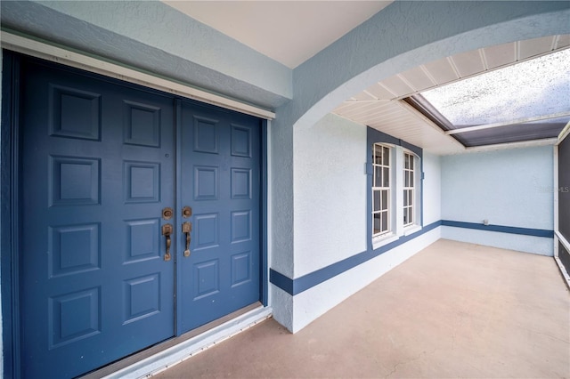 1314 SE 15th Ter, Cape Coral, FL 33990 - view of exterior entry with stucco siding and covered porch