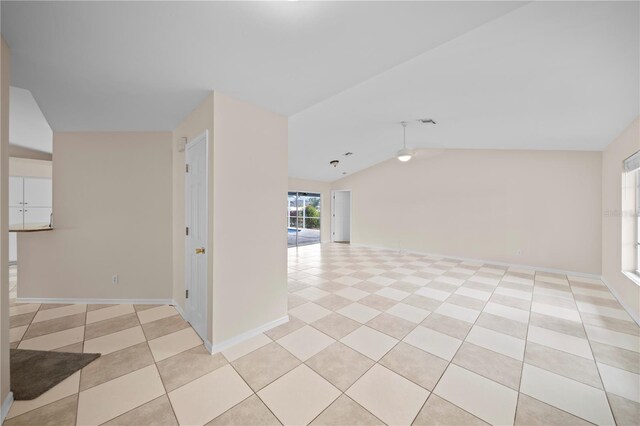 1314 SE 15th Ter, Cape Coral, FL 33990 - unfurnished room with lofted ceiling, ceiling fan, light tile patterned floors, and baseboards