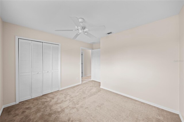 1314 SE 15th Ter, Cape Coral, FL 33990 - unfurnished bedroom with carpet flooring, baseboards, a closet, and a ceiling fan