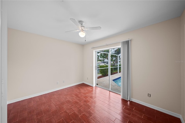 1314 SE 15th Ter, Cape Coral, FL 33990 - empty room featuring ceiling fan, baseboards, and dark wood-type flooring