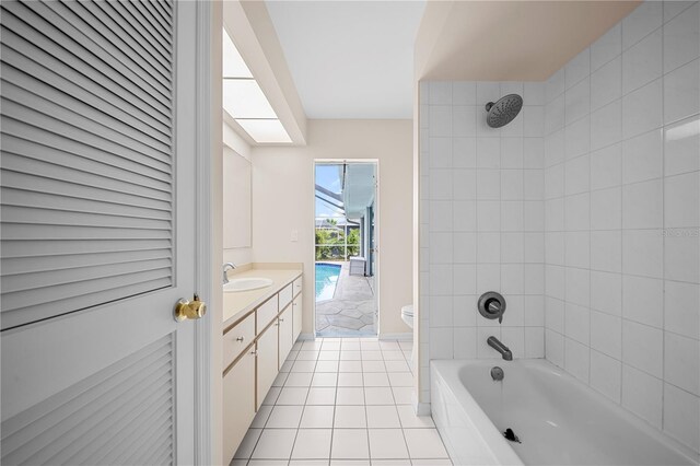 1314 SE 15th Ter, Cape Coral, FL 33990 - bathroom with toilet, vanity, tile patterned floors, and shower / tub combination