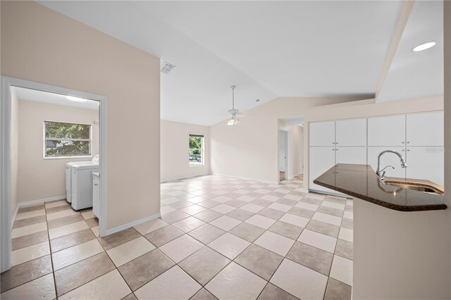 1314 SE 15th Ter, Cape Coral, FL 33990 - kitchen featuring washer and dryer, a sink, lofted ceiling, ceiling fan, and light tile patterned flooring