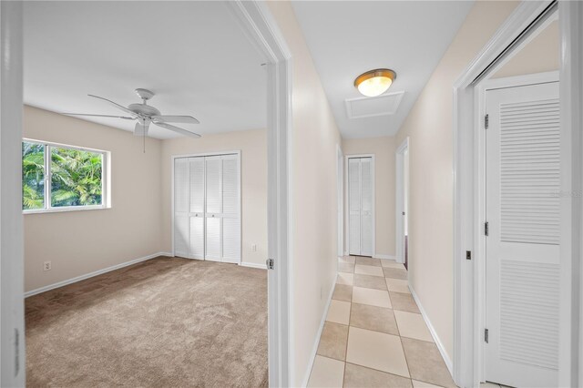 1314 SE 15th Ter, Cape Coral, FL 33990 - hall featuring baseboards, attic access, and light colored carpet