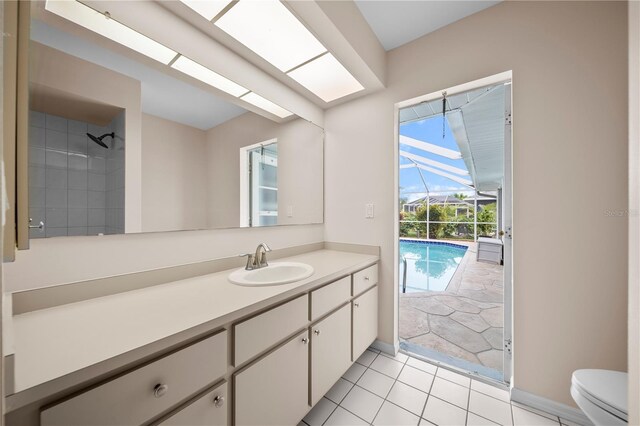 1314 SE 15th Ter, Cape Coral, FL 33990 - bathroom with toilet, vanity, baseboards, and tile patterned floors