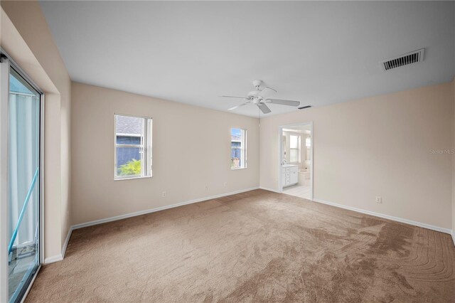1314 SE 15th Ter, Cape Coral, FL 33990 - unfurnished room with carpet, a ceiling fan, and baseboards