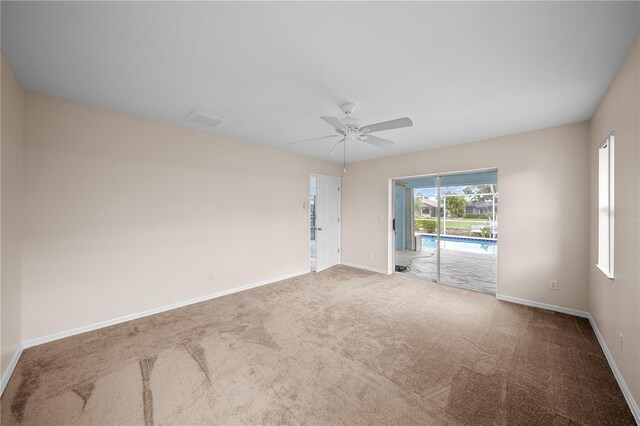1314 SE 15th Ter, Cape Coral, FL 33990 - carpeted spare room with baseboards and ceiling fan