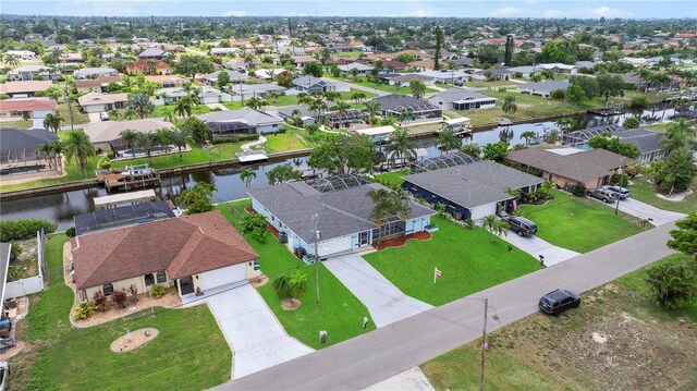1314 SE 15th Ter, Cape Coral, FL 33990 - aerial perspective of suburban area with a nearby body of water