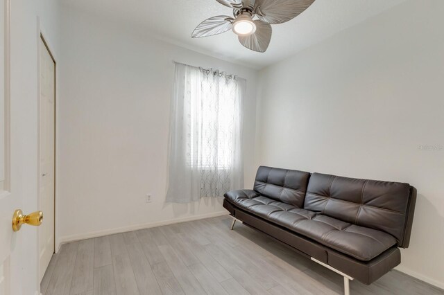 3402 Parkridge Cir, Sarasota, FL 34243 - sitting room with a ceiling fan, light wood-type flooring, and baseboards