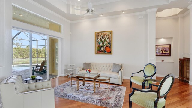 7081 Grassland Ct, Sarasota, FL 34241 - living room featuring ceiling fan, crown molding, and wood finished floors