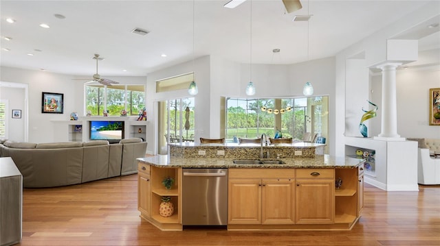 7081 Grassland Ct, Sarasota, FL 34241 - kitchen with stainless steel dishwasher, open shelves, a ceiling fan, light wood finished floors, and recessed lighting