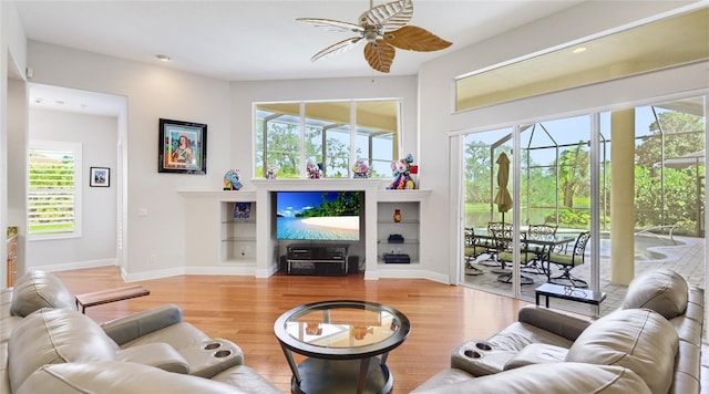7081 Grassland Ct, Sarasota, FL 34241 - living area featuring ceiling fan, healthy amount of natural light, and wood finished floors