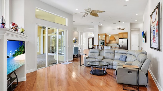 7081 Grassland Ct, Sarasota, FL 34241 - living area with ceiling fan, recessed lighting, light wood-style floors, and ornate columns