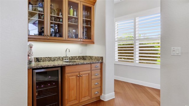 7081 Grassland Ct, Sarasota, FL 34241 - indoor wet bar with wine cooler and wood finished floors