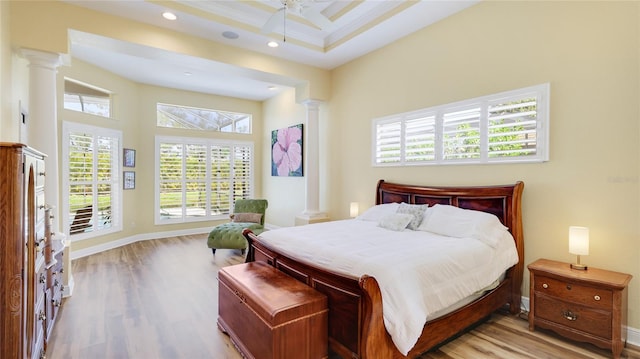 7081 Grassland Ct, Sarasota, FL 34241 - bedroom with ornate columns, wood finished floors, recessed lighting, and a ceiling fan