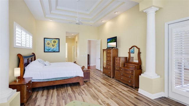 7081 Grassland Ct, Sarasota, FL 34241 - bedroom with decorative columns, wood finished floors, multiple windows, and crown molding