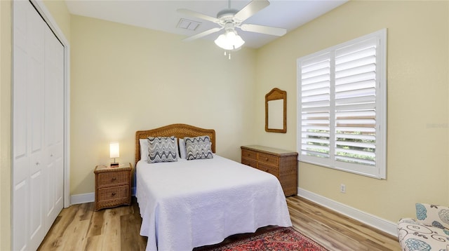 7081 Grassland Ct, Sarasota, FL 34241 - bedroom featuring wood finished floors, a closet, and ceiling fan