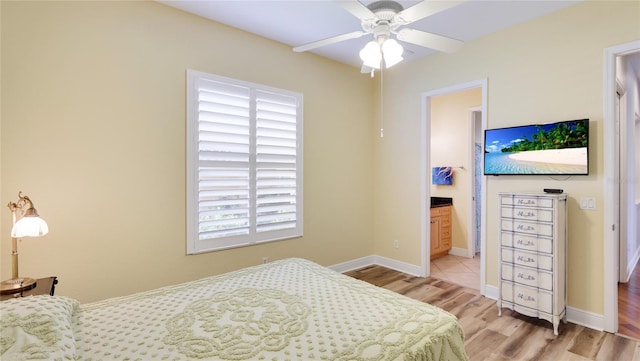 7081 Grassland Ct, Sarasota, FL 34241 - bedroom with wood finished floors and ensuite bathroom