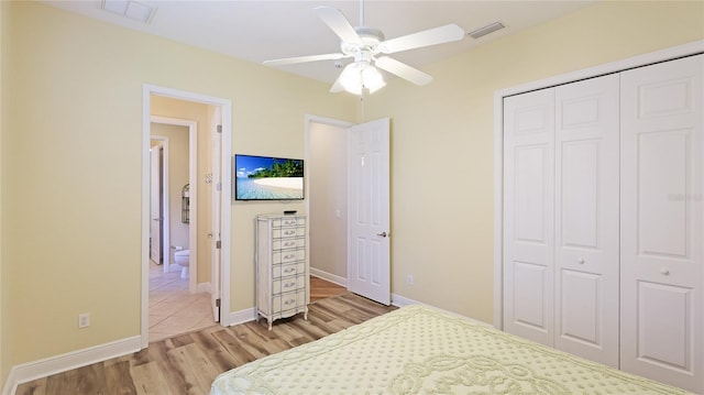 7081 Grassland Ct, Sarasota, FL 34241 - bedroom with light wood-style flooring, a closet, and ceiling fan