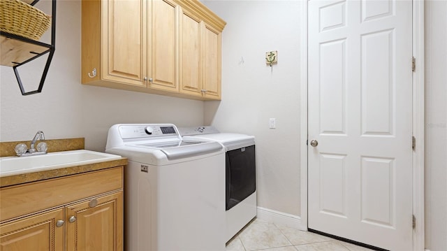 7081 Grassland Ct, Sarasota, FL 34241 - washroom featuring washing machine and clothes dryer, cabinet space, and light tile patterned floors