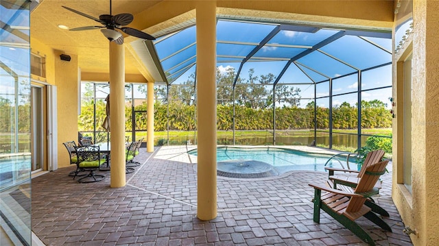 7081 Grassland Ct, Sarasota, FL 34241 - view of patio featuring an outdoor pool, a lanai, ceiling fan, and a water view