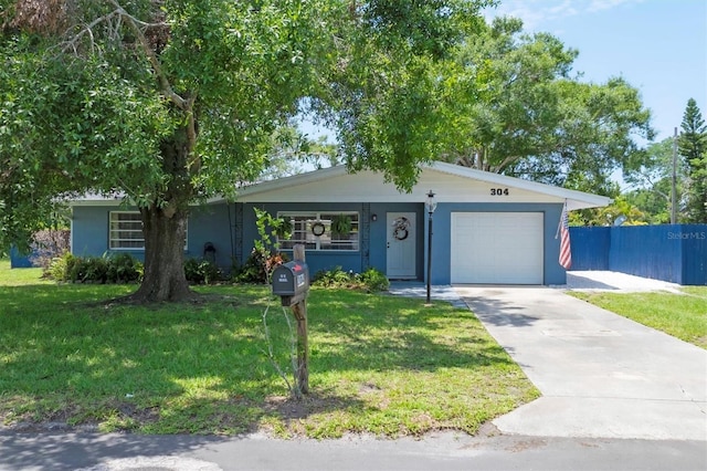 304 34th St W, Bradenton, FL 34205 - ranch-style house with a garage, concrete driveway, and stucco siding