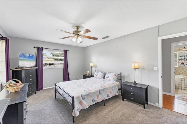 304 34th St W, Bradenton, FL 34205 - carpeted bedroom with baseboards and ceiling fan