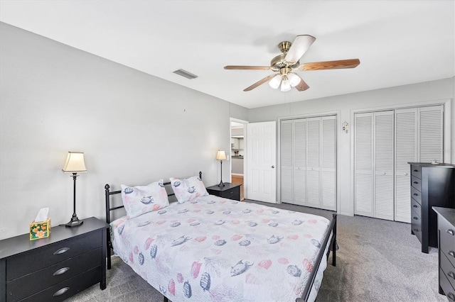 304 34th St W, Bradenton, FL 34205 - carpeted bedroom with two closets and a ceiling fan