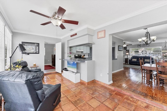 304 34th St W, Bradenton, FL 34205 - living area featuring ceiling fan, baseboards, a chandelier, and ornamental molding