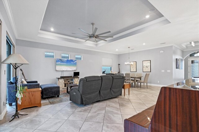 6636 35th Ct E, Sarasota, FL 34243 - living room featuring a raised ceiling, ceiling fan, plenty of natural light, recessed lighting, and ornamental molding