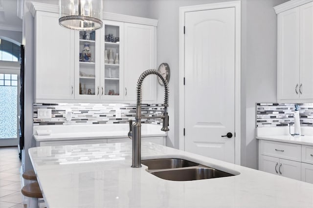 6636 35th Ct E, Sarasota, FL 34243 - kitchen featuring tasteful backsplash, light countertops, and white cabinets