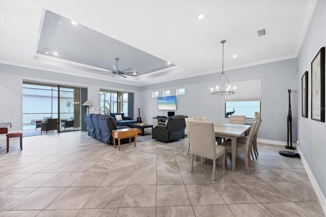6636 35th Ct E, Sarasota, FL 34243 - dining space with a chandelier, ornamental molding, a ceiling fan, a raised ceiling, and baseboards