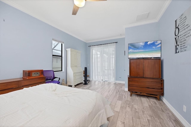 6636 35th Ct E, Sarasota, FL 34243 - bedroom featuring light wood finished floors, crown molding, baseboards, and a ceiling fan