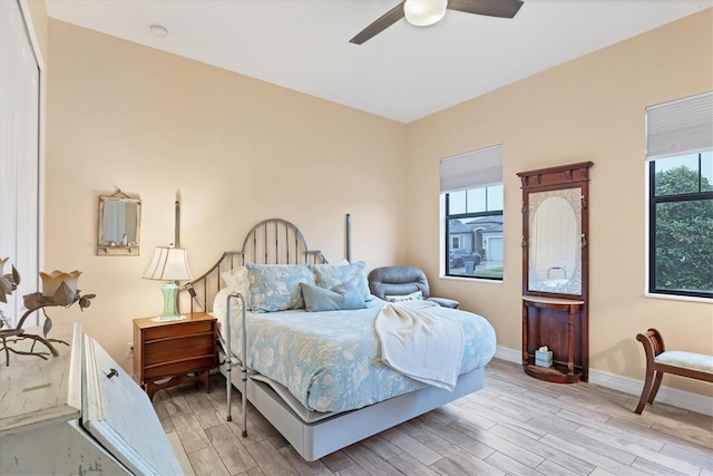 6636 35th Ct E, Sarasota, FL 34243 - bedroom featuring light wood-style flooring, baseboards, and ceiling fan