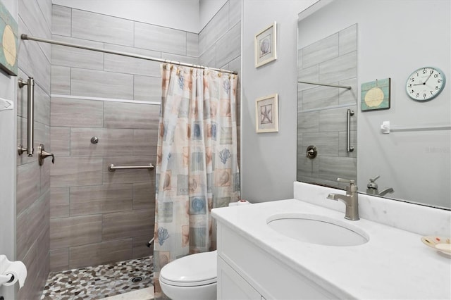 6636 35th Ct E, Sarasota, FL 34243 - bathroom with toilet, vanity, and a tile shower