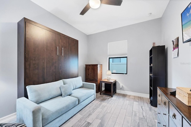 6636 35th Ct E, Sarasota, FL 34243 - sitting room featuring baseboards, light wood-style flooring, and ceiling fan