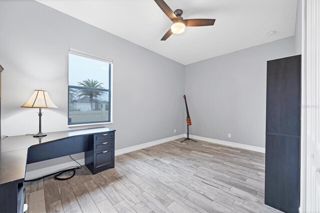 6636 35th Ct E, Sarasota, FL 34243 - unfurnished office featuring light wood-style flooring, a ceiling fan, and baseboards