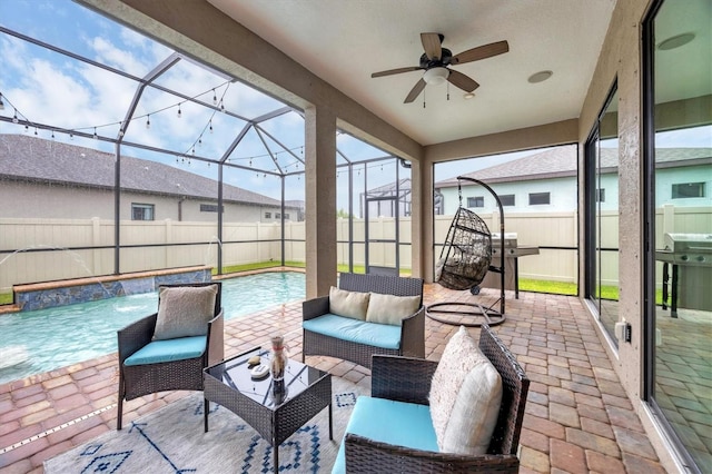 6636 35th Ct E, Sarasota, FL 34243 - fenced backyard featuring a ceiling fan, a patio area, an outdoor living space, a lanai, and a grill