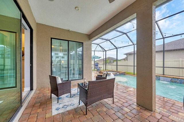 6636 35th Ct E, Sarasota, FL 34243 - view of patio / terrace with a pool with connected hot tub and glass enclosure