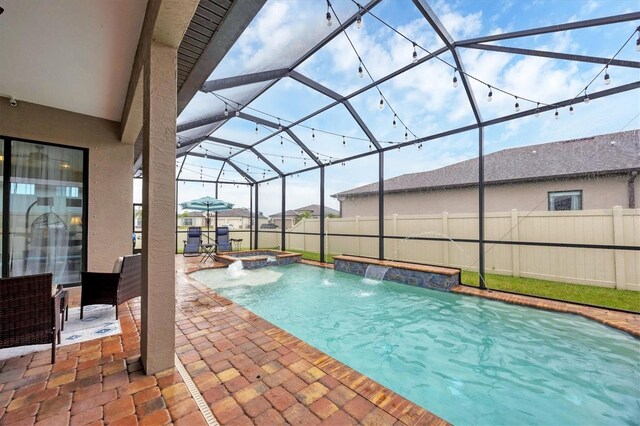 6636 35th Ct E, Sarasota, FL 34243 - view of pool with a patio area, a fenced backyard, a pool with connected hot tub, and a lanai