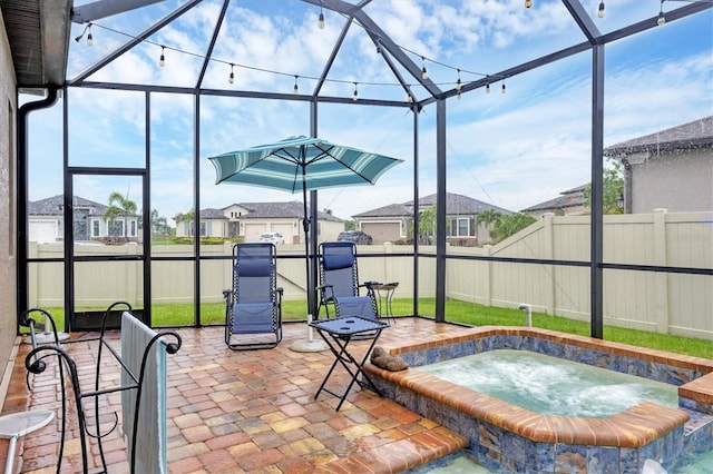 6636 35th Ct E, Sarasota, FL 34243 - fenced backyard featuring an in-ground hot tub, a patio area, a residential view, and a lanai