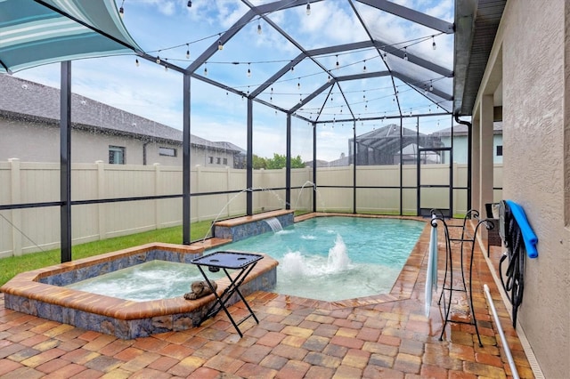 6636 35th Ct E, Sarasota, FL 34243 - view of pool featuring an in-ground hot tub, a fenced backyard, glass enclosure, and a patio