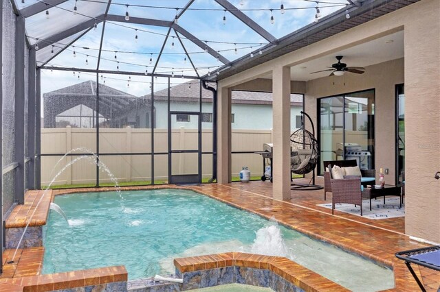 6636 35th Ct E, Sarasota, FL 34243 - view of swimming pool with a ceiling fan, a patio area, a lanai, and a pool with connected hot tub
