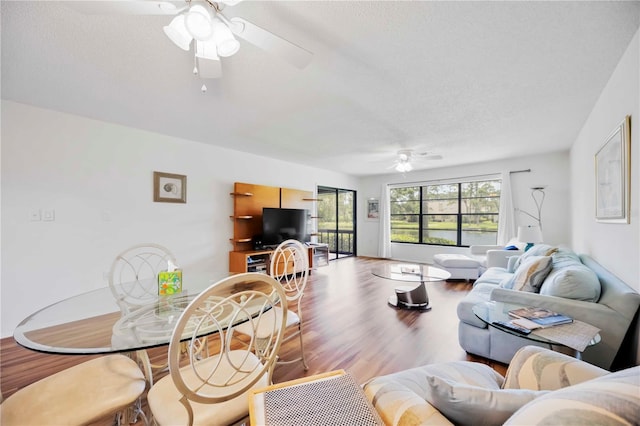 7926 Woodpointe Ct Unit 29, Sarasota, FL 34238 - living room with ceiling fan, wood finished floors, and a textured ceiling