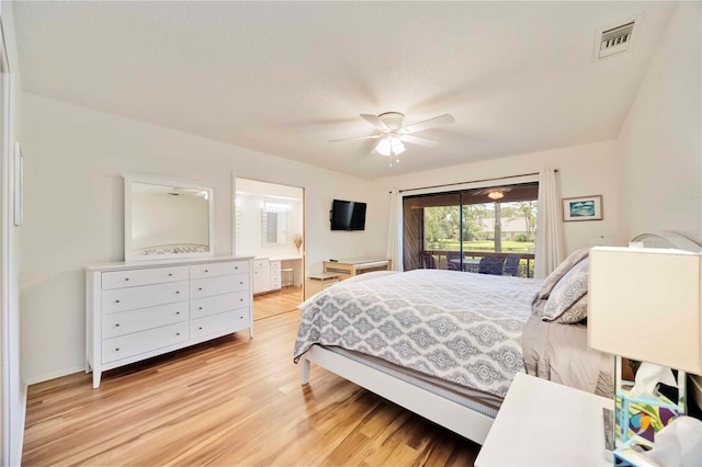 7926 Woodpointe Ct Unit 29, Sarasota, FL 34238 - bedroom featuring light wood-style flooring, access to exterior, connected bathroom, and a ceiling fan